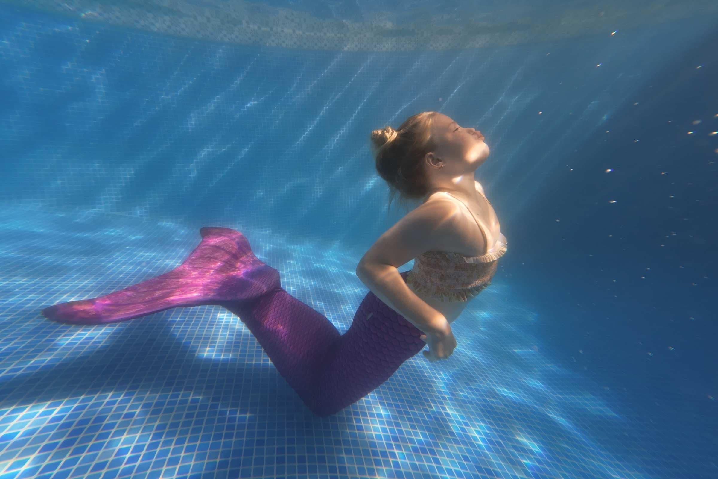 Perfect mermaid poses for underwater modeling