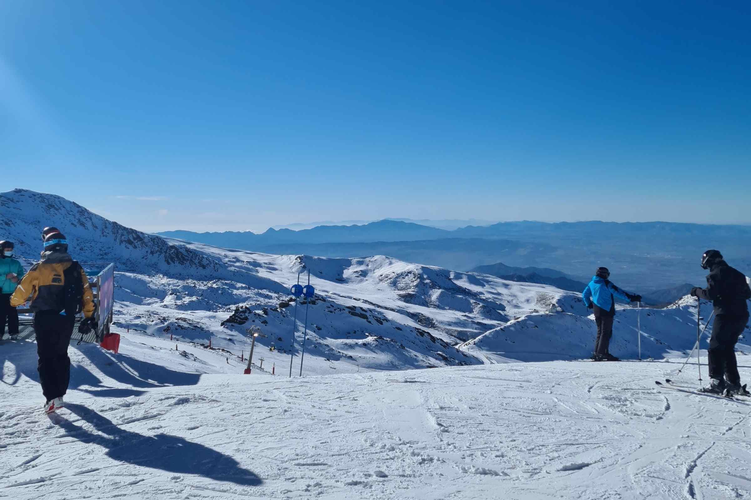 Sierra Nevada skiing mountian view with people skiing