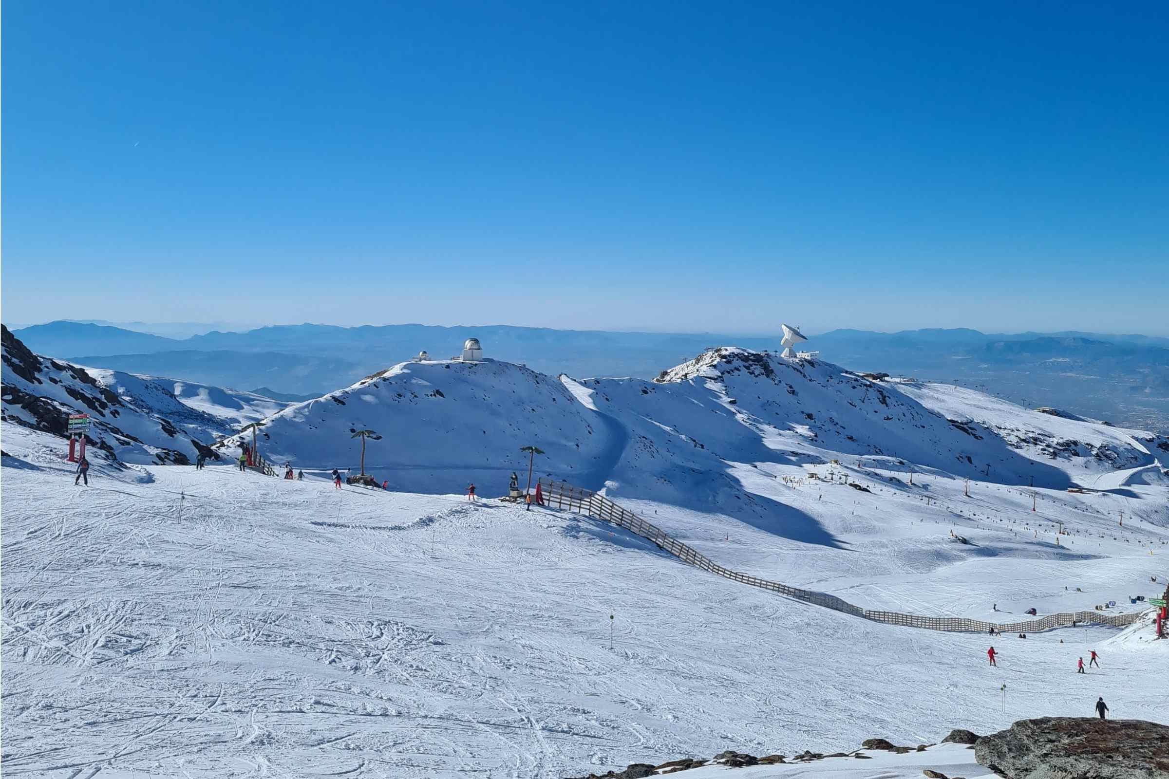 Sierra Nevada skiing mountian view with people skiing