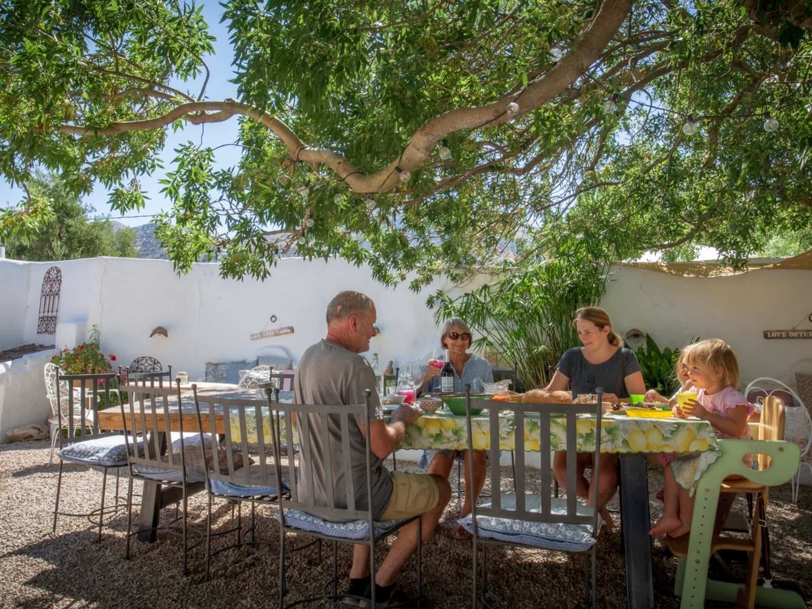 Large communal outdoor dining table at Cortijo Los Lobos